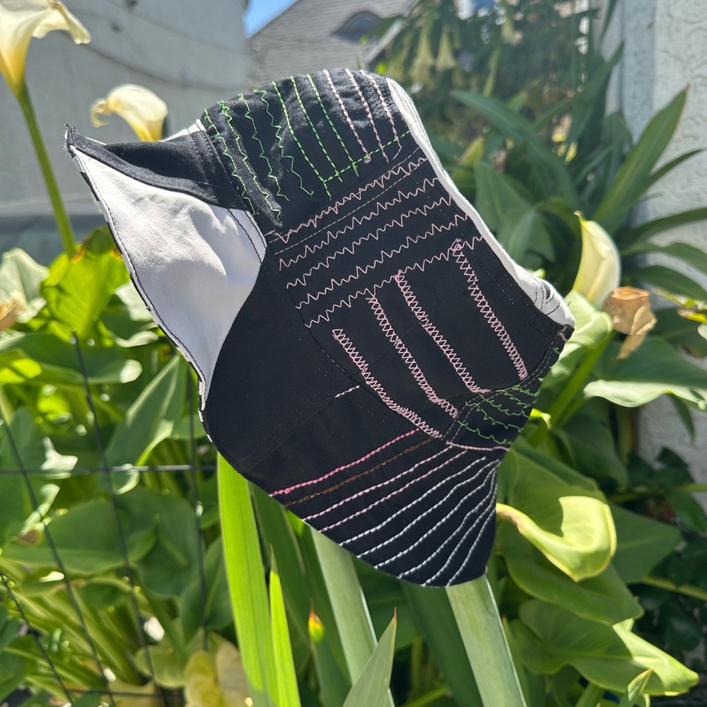 Chic Black and White Hat with Colorful Stitching